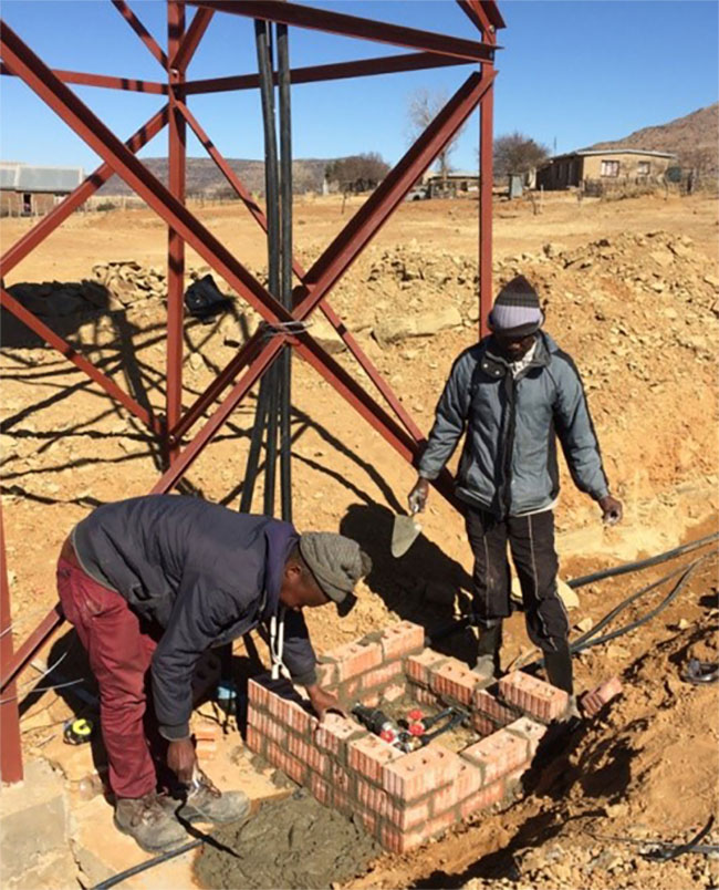 Local residents building valve chambers at Ha Moletsane village